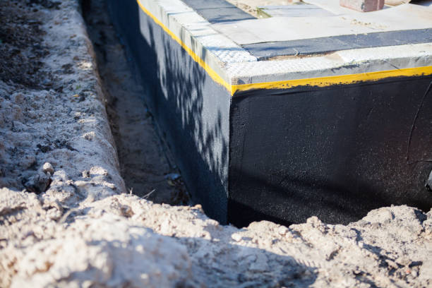 Professional Basement Waterproofing technician working in Walkersville, MD